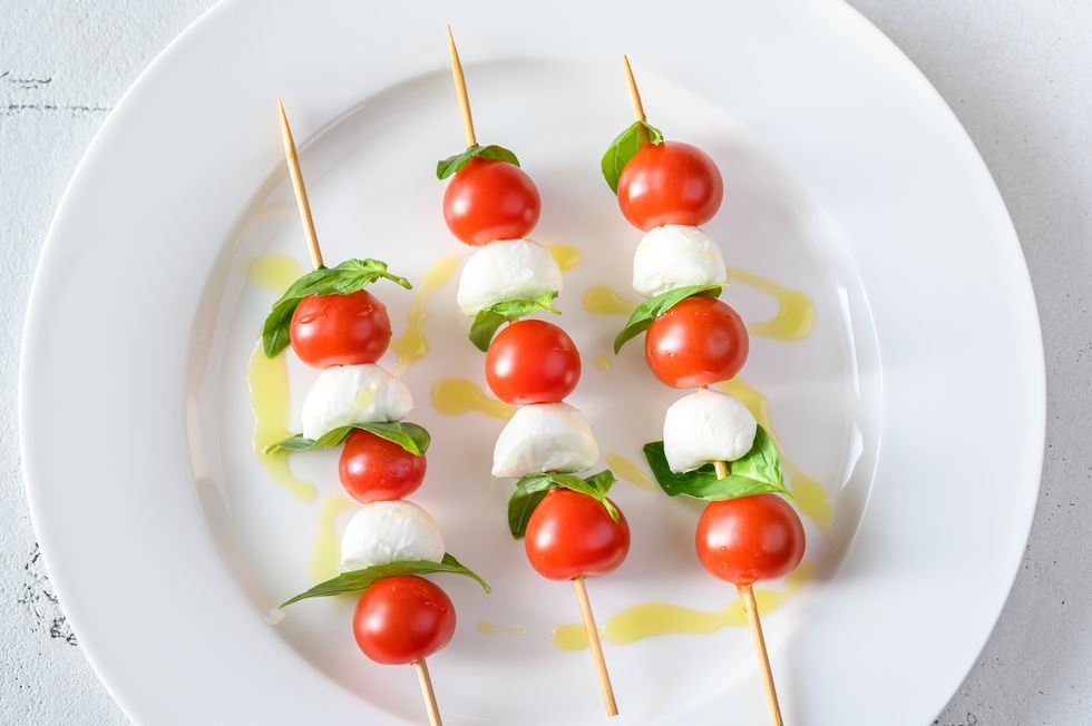caprese salad skewers on white plate top view,romania