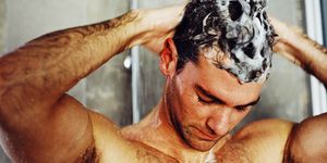 close-up of a man washing his hair in the shower