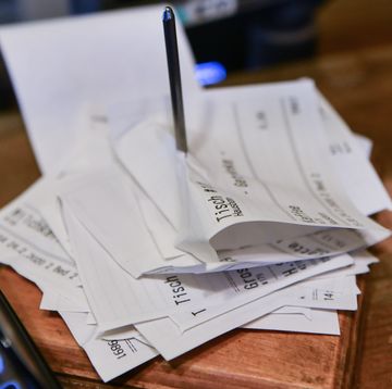 24 february 2020, berlin next to a cash register in a cafe, sales receipts are skewered photo jens kalaenedpa zentralbildzb photo by jens kalaenepicture alliance via getty images