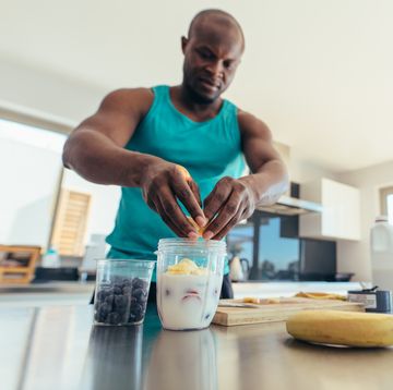 man preparing breakfast in kitchen