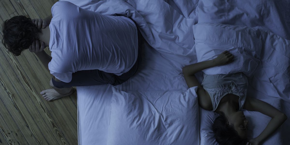 man unable to sleep while wife sleeps comfortably unaware