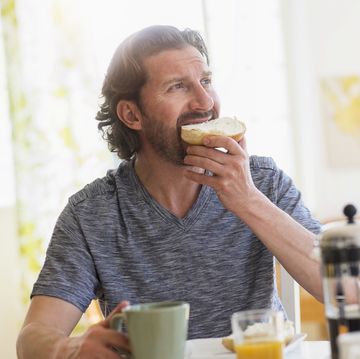 mature man eating breakfast